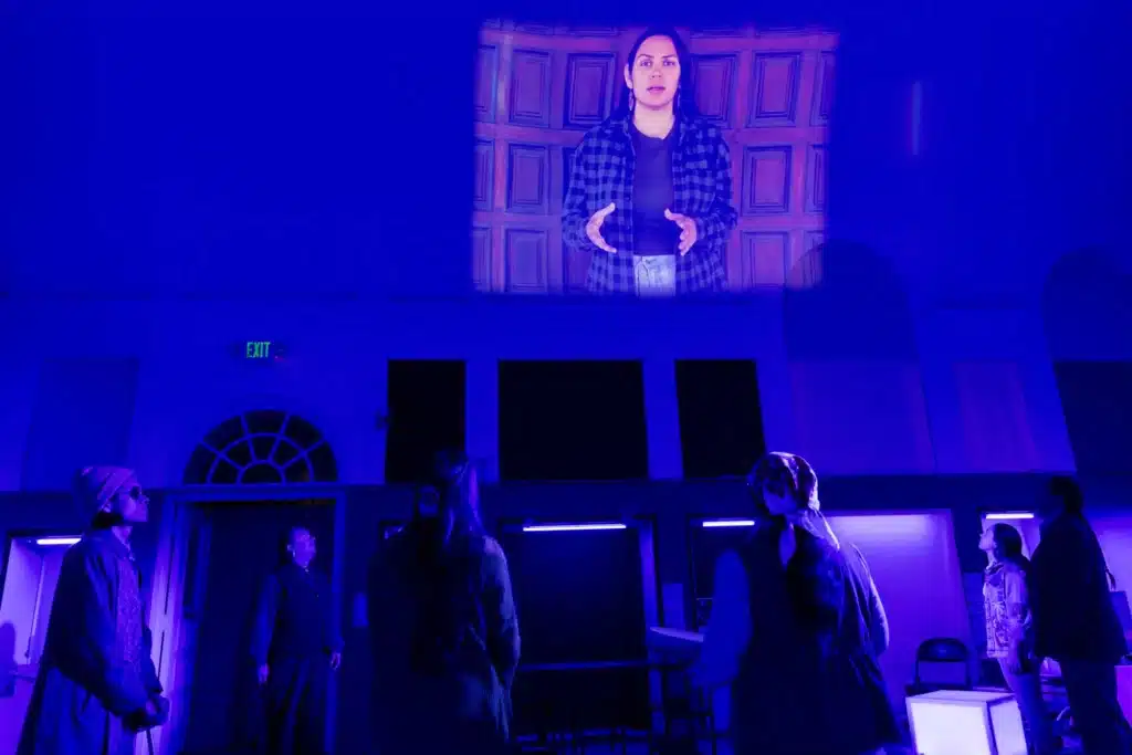 Erin Xáalnook Tripp, Nikcoma Lee Mahkewa, Frank Henry Katasse, Isabella Madrigal, Arigon Starr, Kholan Studi, Gigi Buddie in Antíkoni by Beth Piatote at Native Voices. Directed by Madeline Sayet. Scenic design by Troy Hourie.  Costume design by Asa Benally.  Lighting design by Pablo Santiago.  Projections design by Yee Eun Nam. Sound design by UptownWorks. Vocal Coach Sayda Trujillo. Stage manager Kimberly Sanchez Garrido. Photo by Grettel Cortes Photography. 